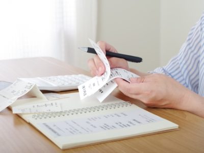 A,Woman,Who,Keeps,A,Household,Account,Book,And,Manages