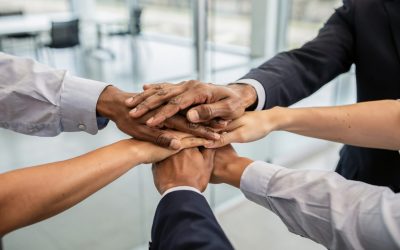 Close-up,Of,Diverse,Business,Team,Joining,Hands,In,Office,Representing